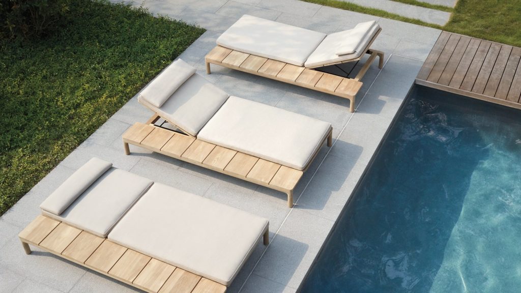Three chaises poolside.