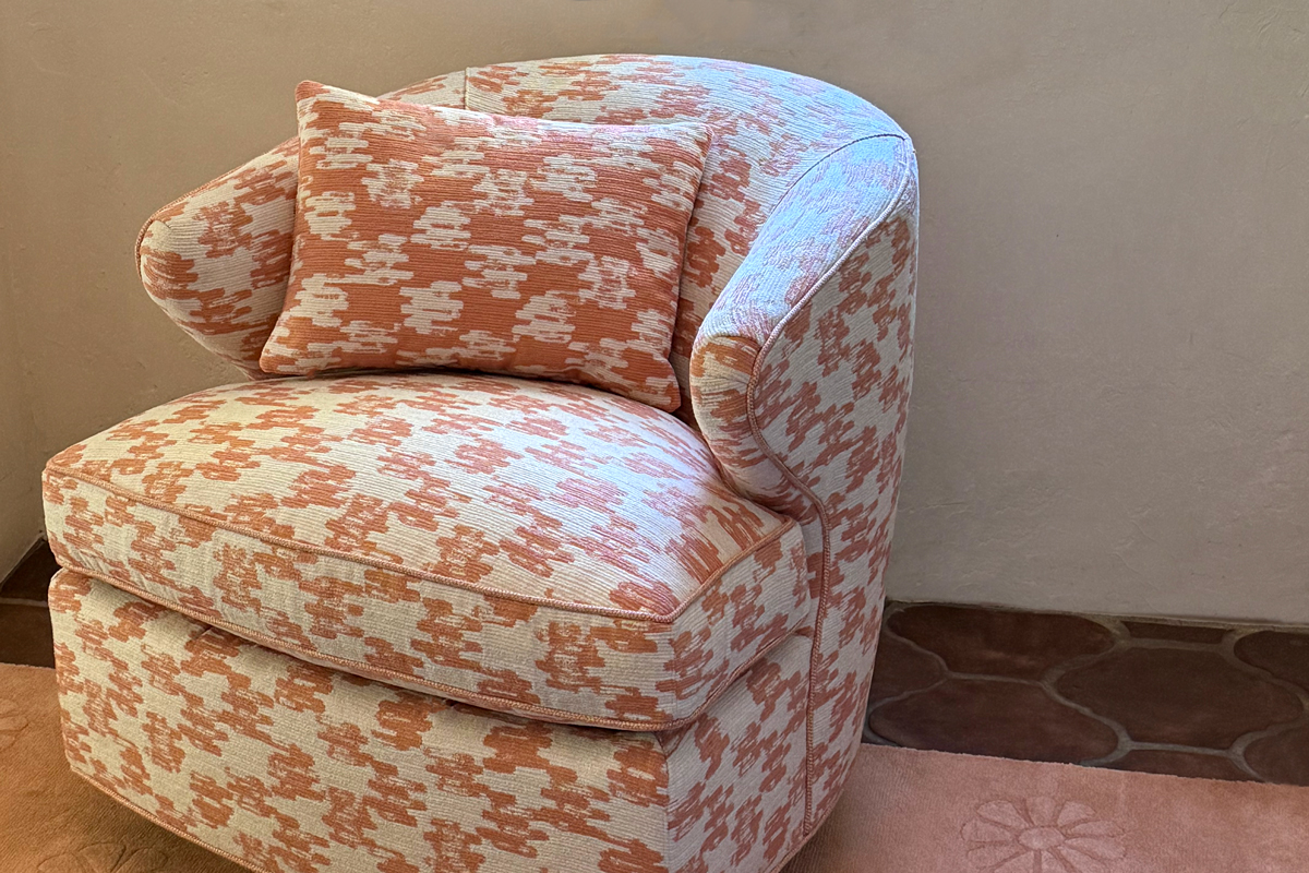 Tinta Melon fabric upholstered on lounge chair